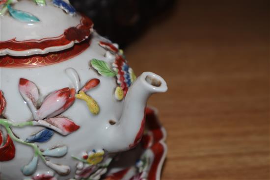 An 18th century Chinese Export famille rose teapot, cover and a similar dish